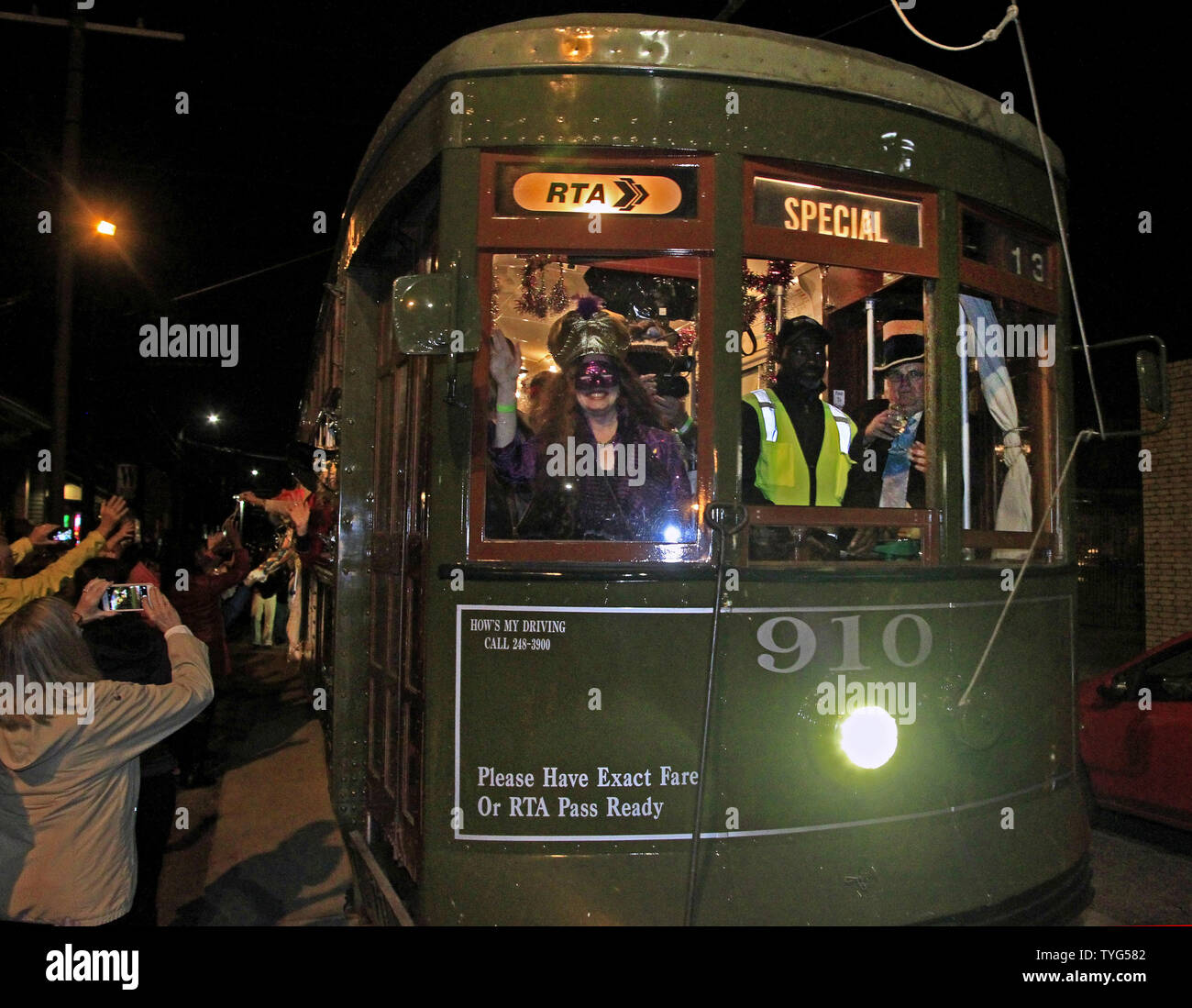 Member of the Phunny Phorty Phellows, 'The Heralds of Carnival,' celebrates the start of the 2016 Carnival season in New Orleans with a streetcar ride down St. Charles Avenue on Twelfth Night, January 6, 2016.The Mardi Gras organization is known for its satirical parade, and members' costumes often reflect topical themes.  Photo by AJ Sisco/UPI Stock Photo