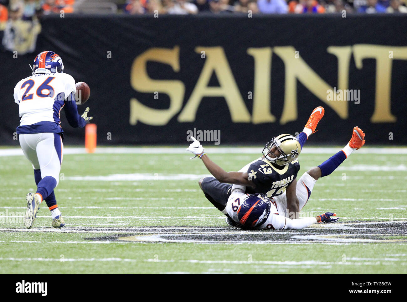 Denver Broncos free safety Darian Stewart (26) intercepts a ball tipped by New Orleans Saints wide receiver Michael Thomas (13) after he was contacted by Broncos cornerback Bradley Roby (29) in the second quarter at the Mercedes-Benz Superdome in New Orleans November 13, 2016. Photo by AJ Sisco/UPI Stock Photo