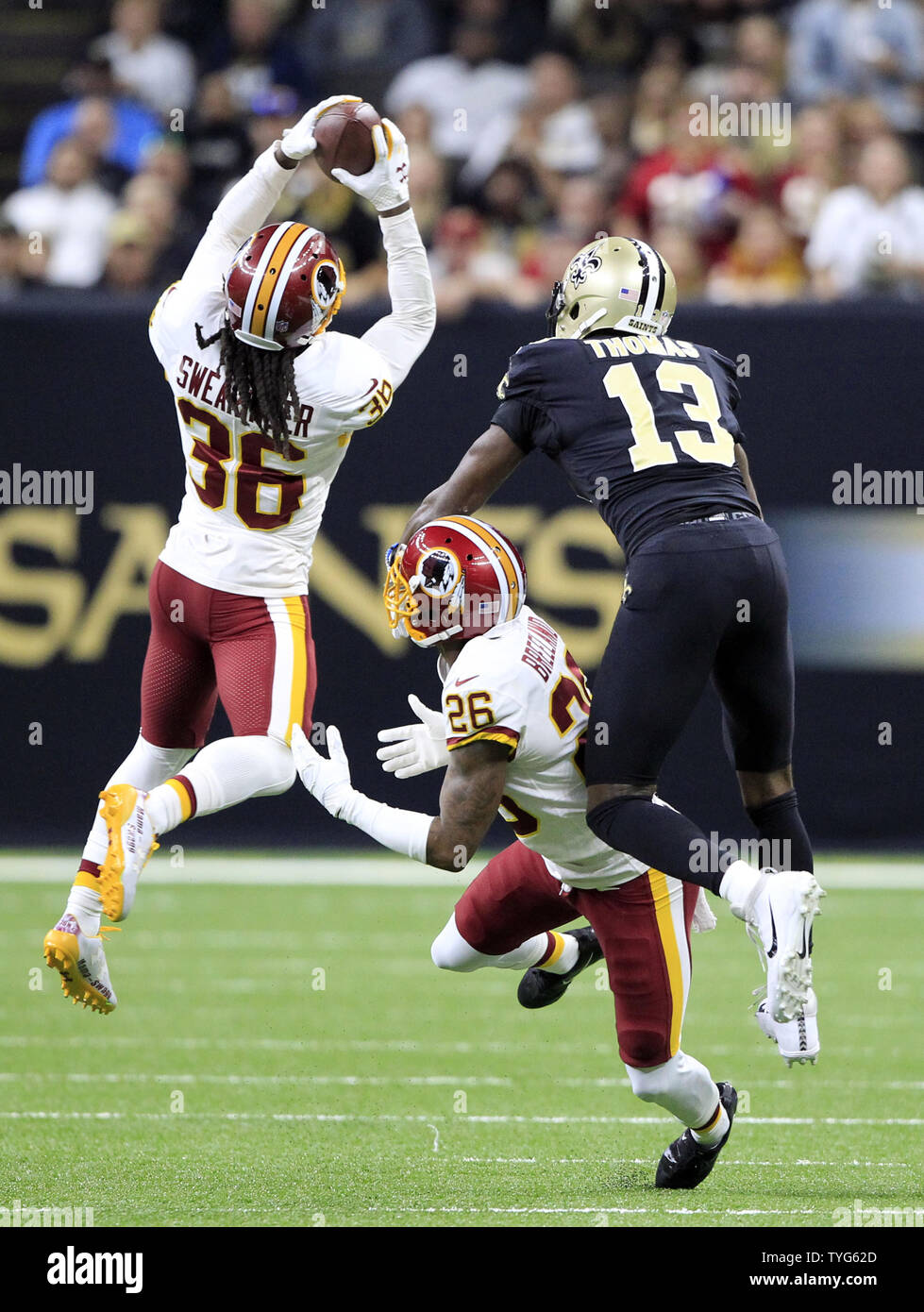 Arlington, Texas, USA. 14th Oct, 2018. Dallas Cowboys wide receiver Michael  Gallup (13) makes a catch with Jacksonville Jaguars cornerback A.J. Bouye  (21) trying to break it up during the first half