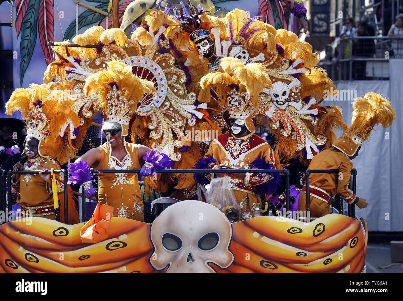 Float riders in the Zulu parade tosses beads to the crowd on St Charles ...