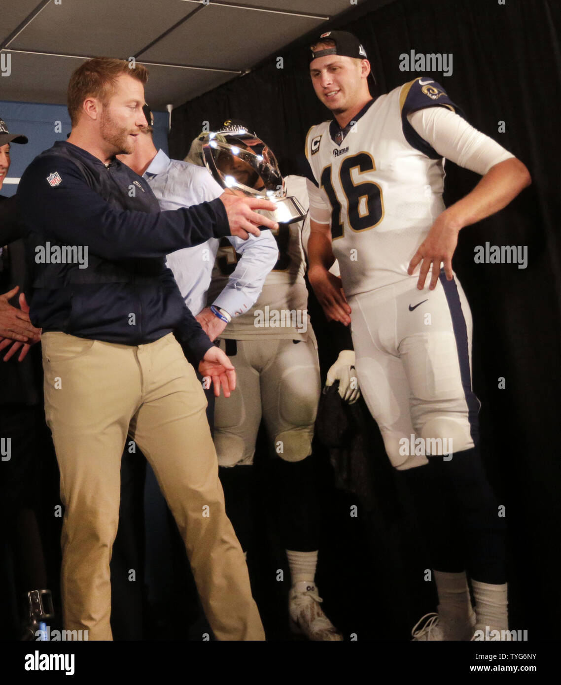 Los Angeles Rams head coach Sean McVay hands the NFC Championship trophy to  Rams quarterback Jared Goff (16) after beating the New Orleans Saints in  overtime at the Mercedes-Benz Superdome in New