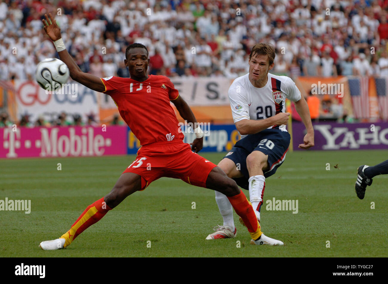 Habib Mohammed of Ghana (L) and Brian Mc Bride of theUSA move toward the ball in the  World Cup soccer action in Nuernberg, Germany on June 22, 2006. Ghana defeated the USA 2-1.  (UPI Photo/Frank Hoermann) Stock Photo