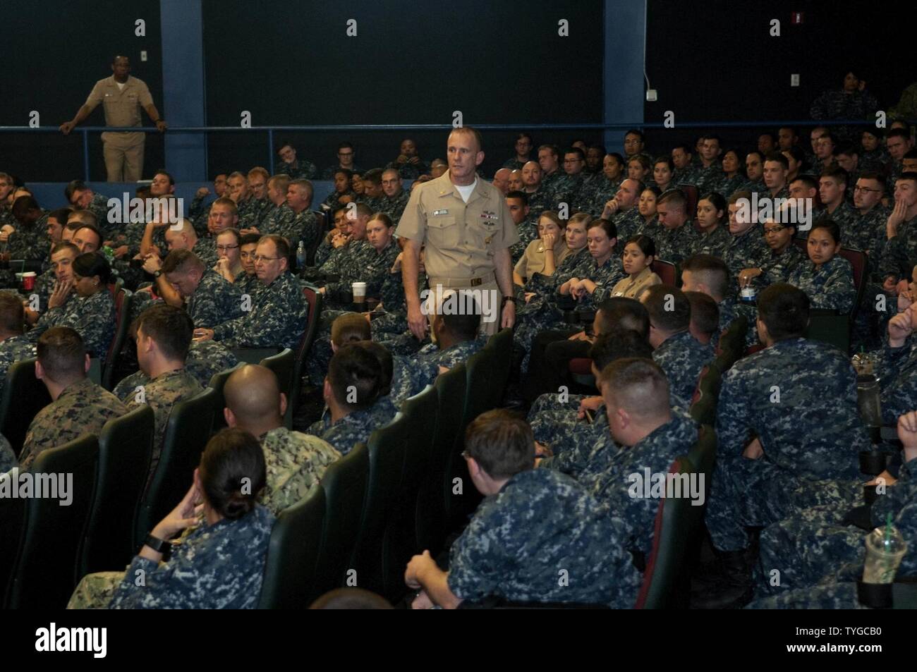 DIEGO (Nov. 8, 2016) The 14th Master Chief Petty Officer of the Navy (MCPON) Steven Giordano speaks with Sailors during an all-hands call at Naval Base San Diego. MCPON addressed current issues in the Navy and participated in a question-and-answer session with Sailors. This is Giordano's first visit to Naval Base San Diego since taking office as the 14th MCPON. Stock Photo