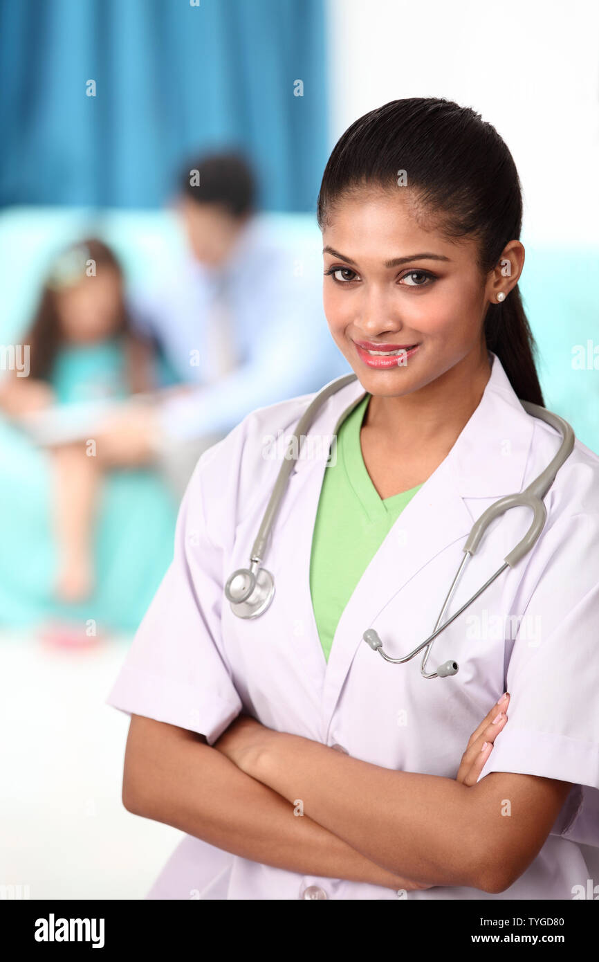Portrait of a female doctor smiling Stock Photo - Alamy
