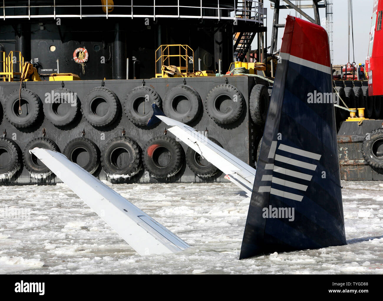 The tail and wing of the wrecked US Air Airbus A320 which made an emergency landing into the river two days ago, sit in the icy waters of the Hudson River  on January 17, 2009 in New York. The icy conditions have delayed removal of the plane and the extraction of the black box flight recorder.  (UPI Photo/Monika Graff) Stock Photo