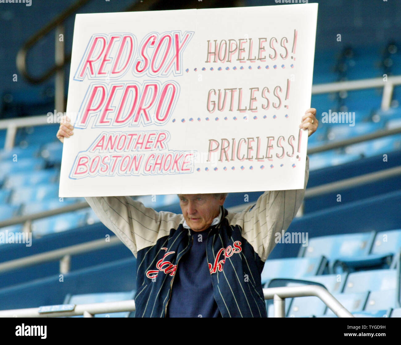 A fan arrives early with sign in hand before the start of game six of the American League championship series playoff between the New York Yankees and Boston Red Sox at Yankee Stadium in New York City on October 15, 2003.  (UPI/Monika Graff) Stock Photo