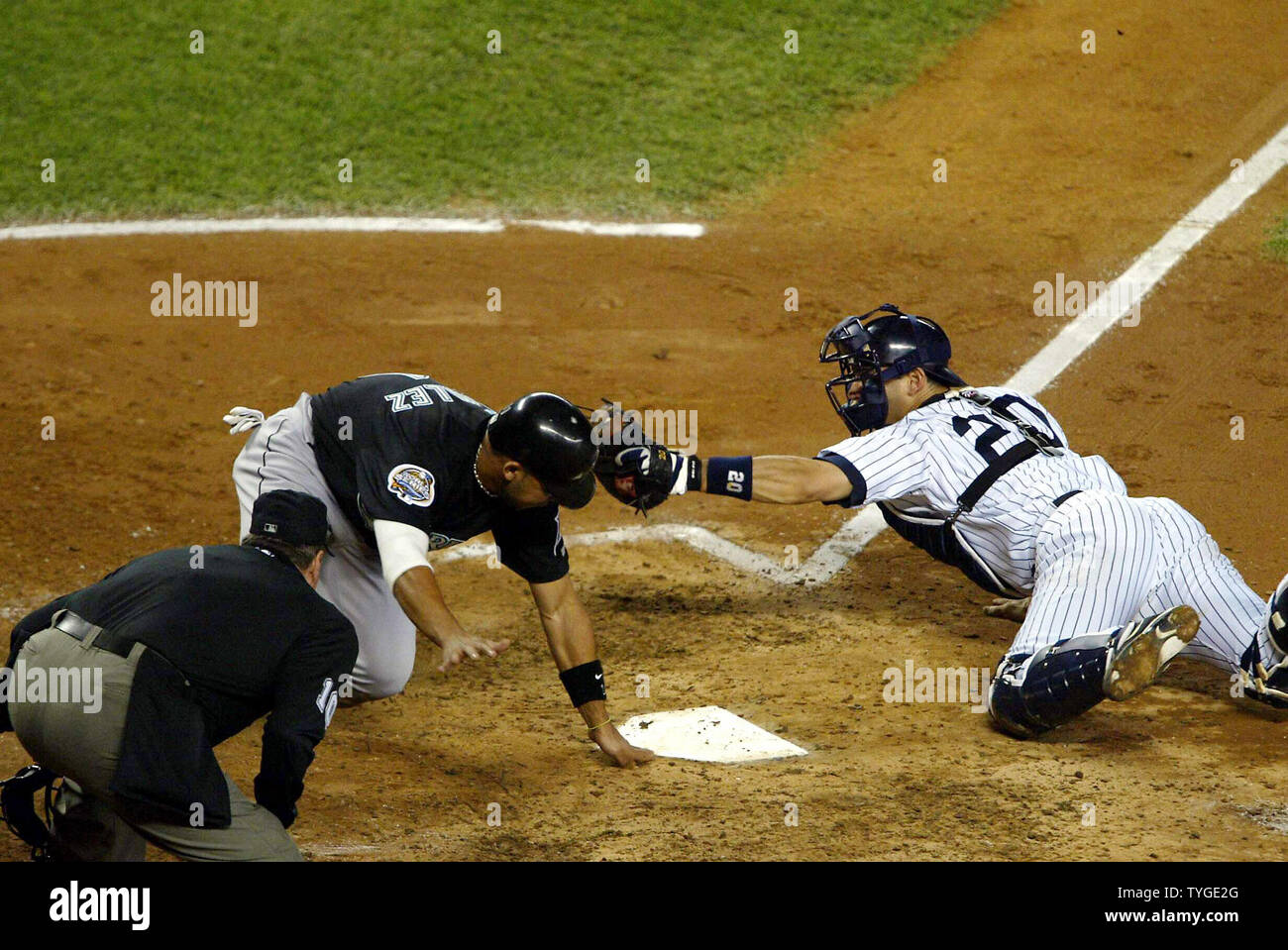 New York Yankees catcher Posada attempts to tag out Alex Gonzalez