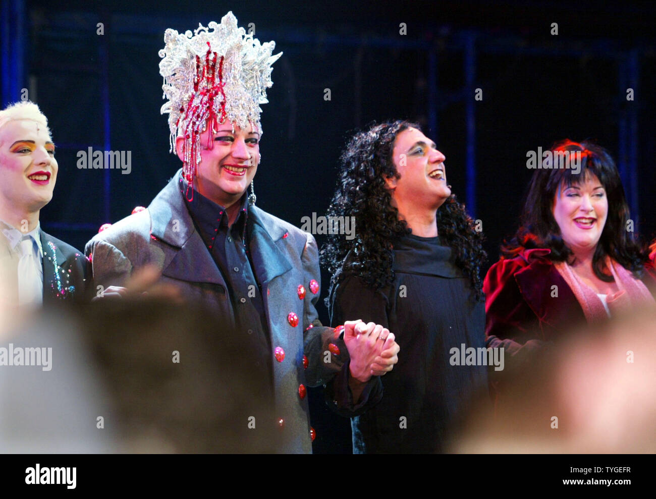 Boy George, second right, is joined by other cast members as they do a curtain call on opening night of Rosie O'Donnell's Broadway production 'Taboo' on November 13, 2003 in New York City. The play, staring Boy George, is about the counter culture of the 1980's.  (UPI/MONIKA GRAFF) Stock Photo