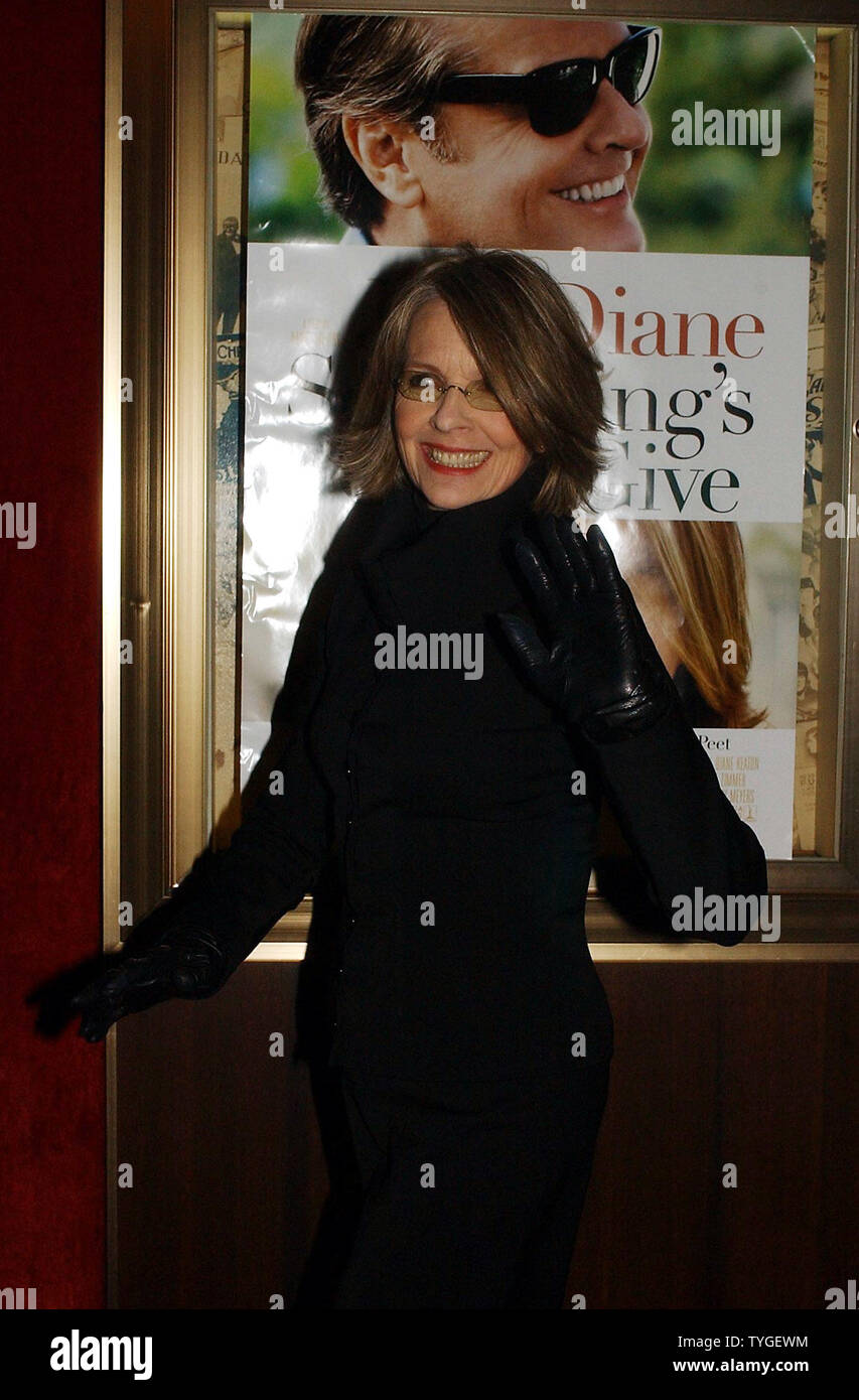 Actress Diane Keaton poses under the film poster of her co-star Jack Nicholson at the Dec. 3, 2003 New York premiere of their new film 'Something's Gotta Give.'  (UPI Photos/Ezio Petersen) Stock Photo