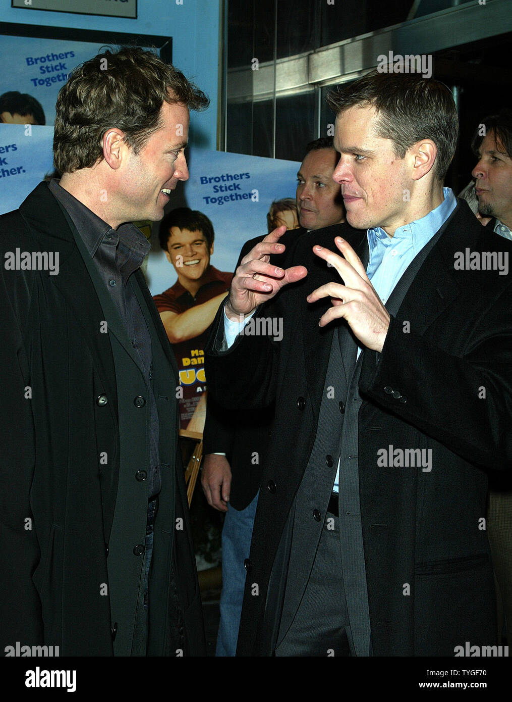 Greg Kinnear (left) and Matt Damon pose for pictures at the premiere of 'Stuck on You' at the Clearview Chelsea West Theater in New York on December 8, 2003.   (UPI Photo/Laura Cavanaugh) Stock Photo