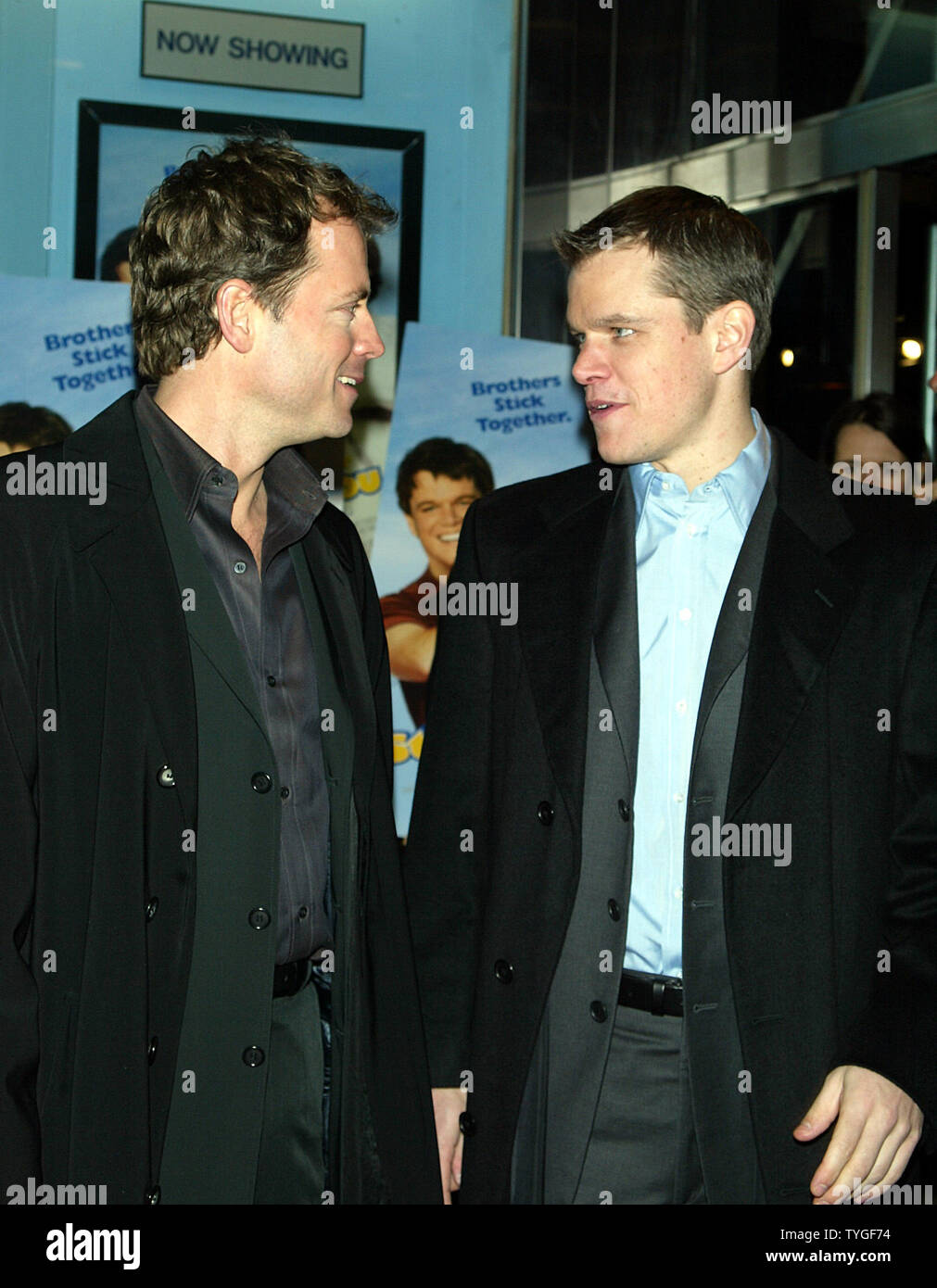 Greg Kinnear (left) and Matt Damon pose for pictures at the premiere of 'Stuck on You' at the Clearview Chelsea West Theater in New York on December 8, 2003.   (UPI Photo/Laura Cavanaugh) Stock Photo