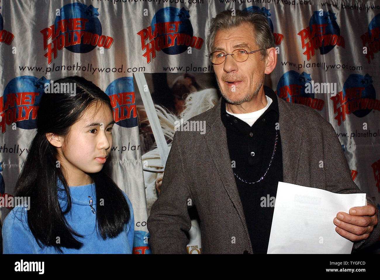Actor Sir Ian Mckellen Who Plays Gandalf In The Lord Of The Rings The Return Of The King Poses With Vivian Truong From New York On Dec 23 03 At A Event Sponsored By