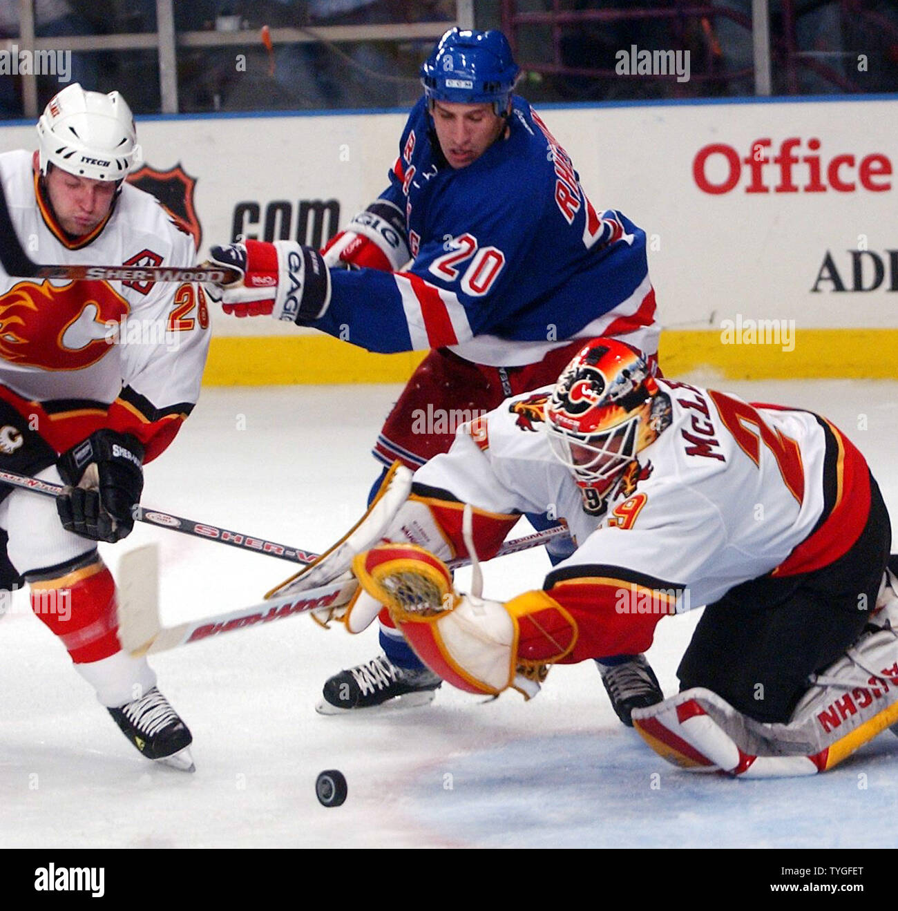 Calgary Flames goalie Jamie McLennan makes one of several