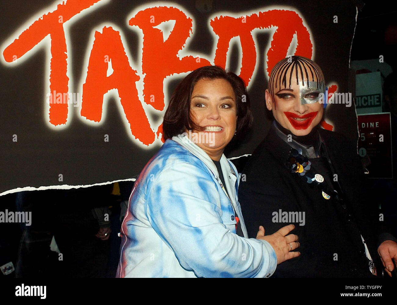 Rosie O' Donnell poses with composer and lyricist Boy George in this Sept. 2003 photo. The Broadway musical 'Taboo', which Boy George wrote and stars in and O'Donnell  produces will close on Feb. 3, 2004 losing her $10 million dollar investment.  (UPI/Ezio Petersen) Stock Photo