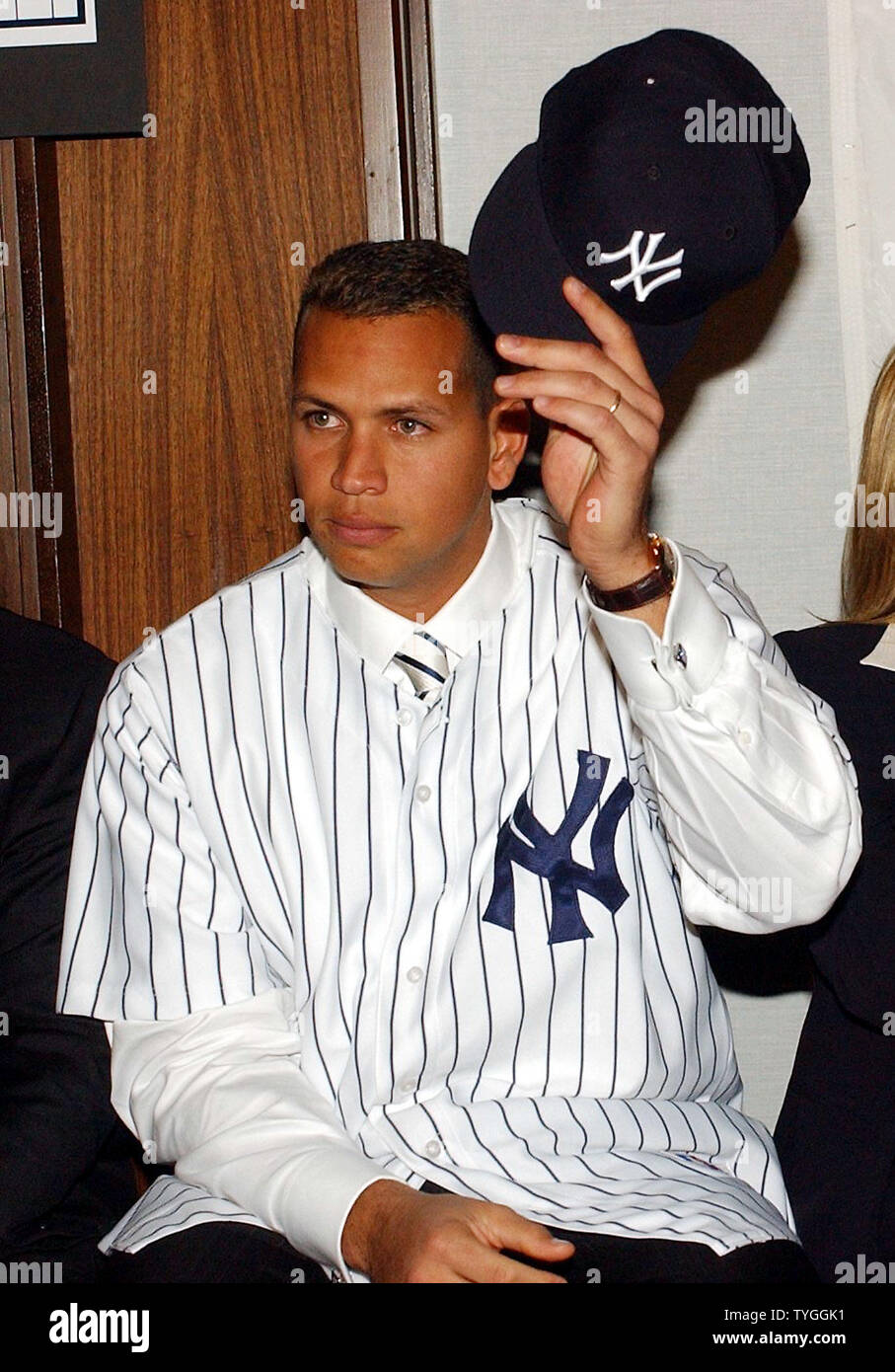 Reigning American League Most Valuable Player Alex Rodriguez tips his hat  to the media covering his Feb. 17, 2004 press conference at New York's  Yankee Stadium after he was introduced as the