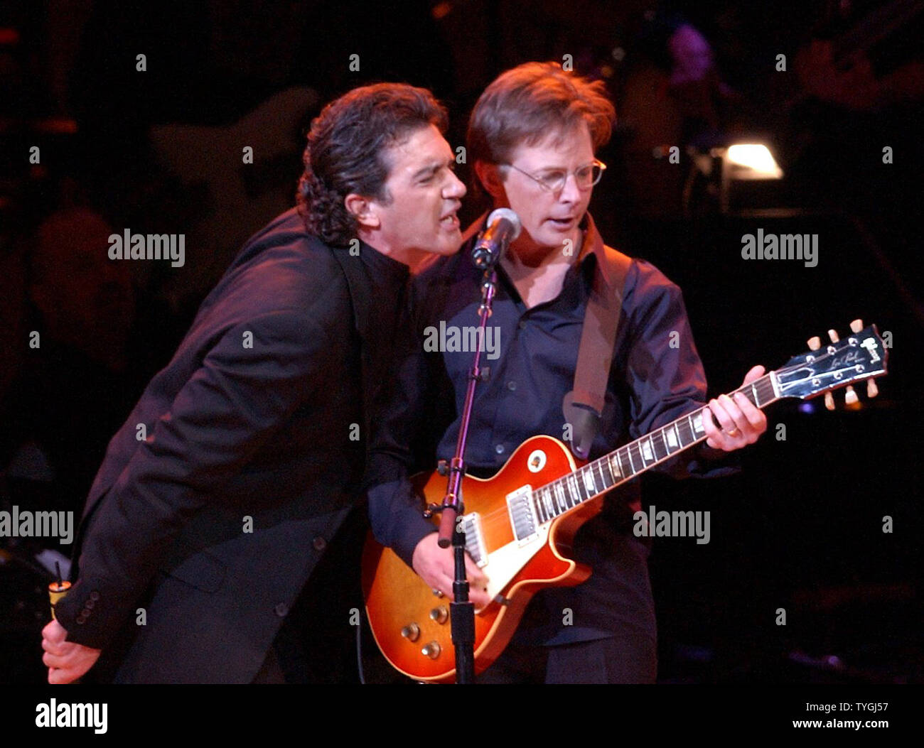 Antonio Banderas and Michael J. Fox (right) perform the song "Johnny B  Goode" at the 12th annual RainForest Foundation Concert held on April 21,  2004 at New York's Carnegie Hall. (UPI/Ezio Petersen