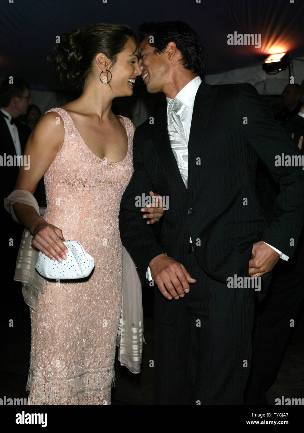Benjamin Bratt and wife Talisa Soto pose for pictures at the Costume Institute Gala Celebrating 'Dangerous Liaisons: Fashion and Furniture in the 18th Century' at the Metropolitan Museum of Art in New York on April 26, 2004.   (UPI Photo/Laura Cavanaugh) Stock Photo