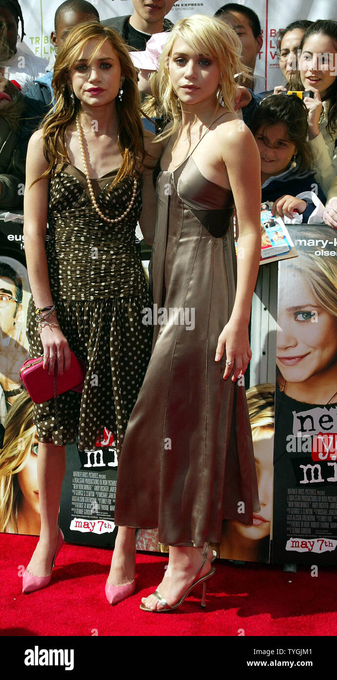 Mary Kate and Ashley Olsen (Ashley is blonde) pose for pictures at the  premiere of their new movie "New York Minute" at the Tribeca Performing  Arts Center in New York on May