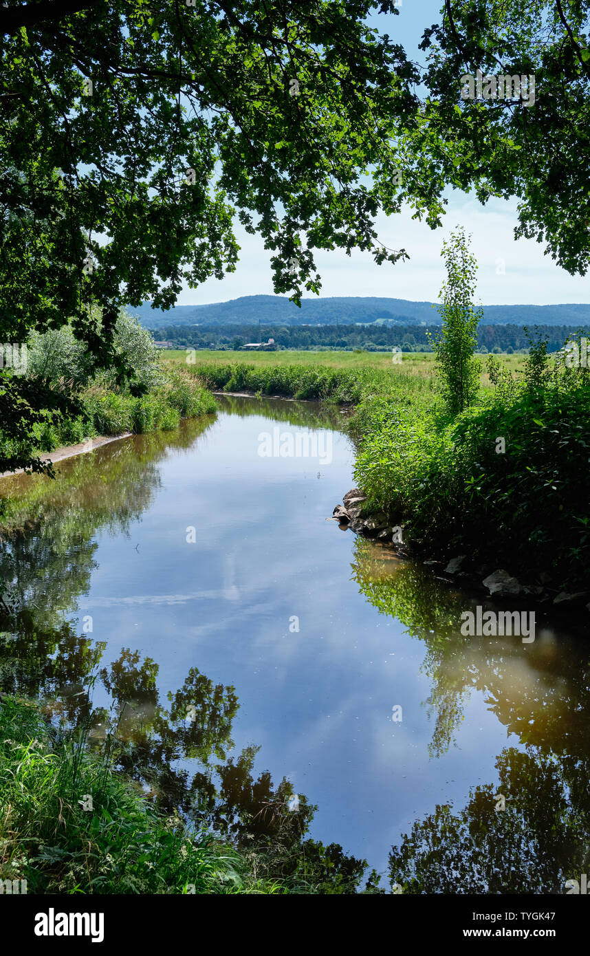 Beautiful scenic view in a landscape near the town of Alzenau in Lower Franconia, Bavaria, Germany, with the river Kahl an the hills of the Spessart Stock Photo