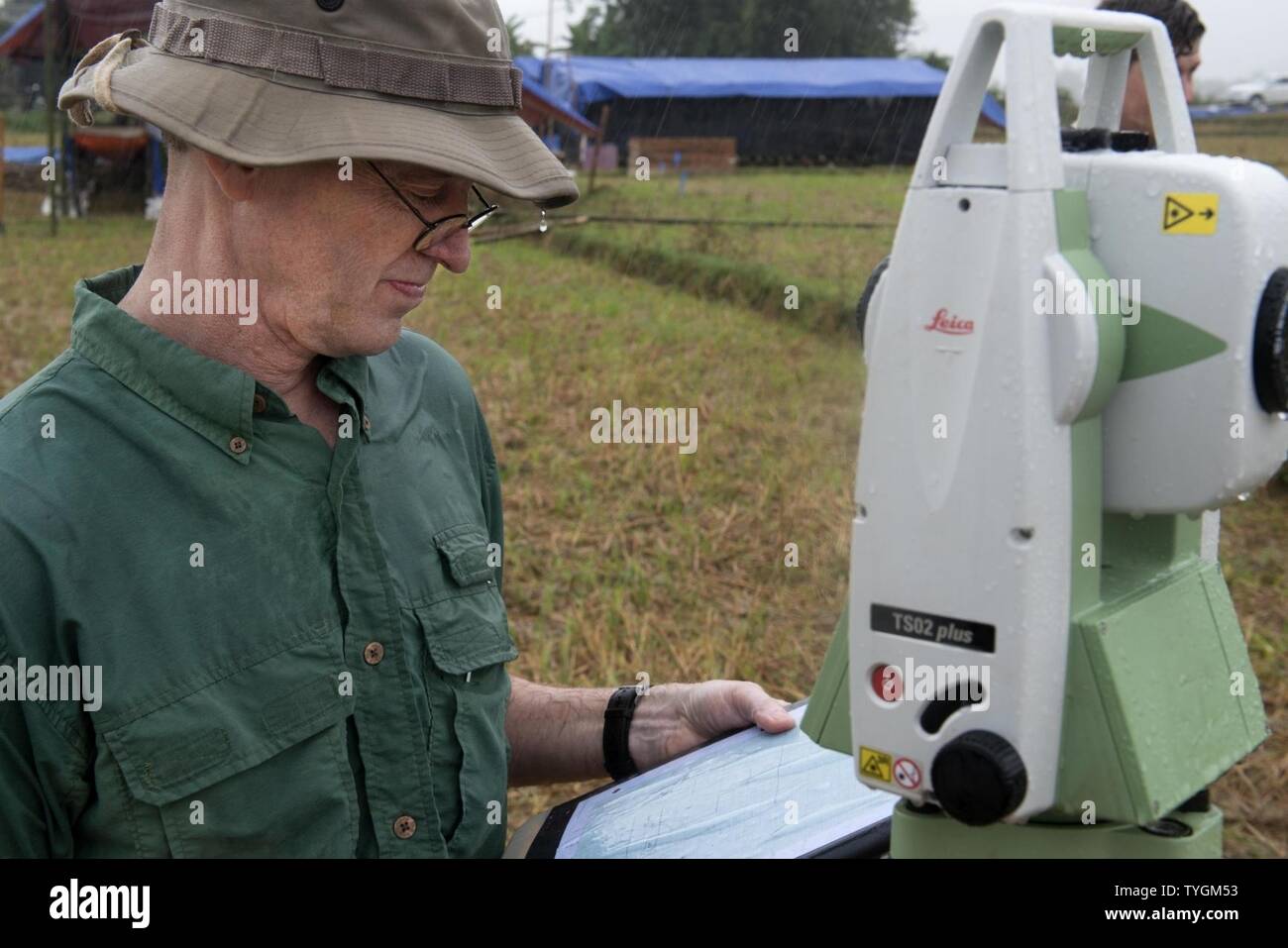 Mark Smith, an anthropologist and augmentee for the Defense POW/MIA Accounting Agency (DPAA), sets-up a grid to begin excavation in Dien Bien, Vietnam, Nov. 8, 2016. Members of DPAA deployed to the area in hopes of recovering the remains of an F-4C aircraft pilot unaccounted for from the Vietnam Conflict. The mission of DPAA is to provide the fullest possible accounting for our missing personnel to their families and the nation. Stock Photo