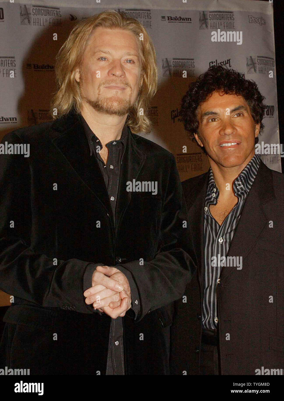 Daryl Hall and John Oates (right) pose for the media on June 10, 2004 ...