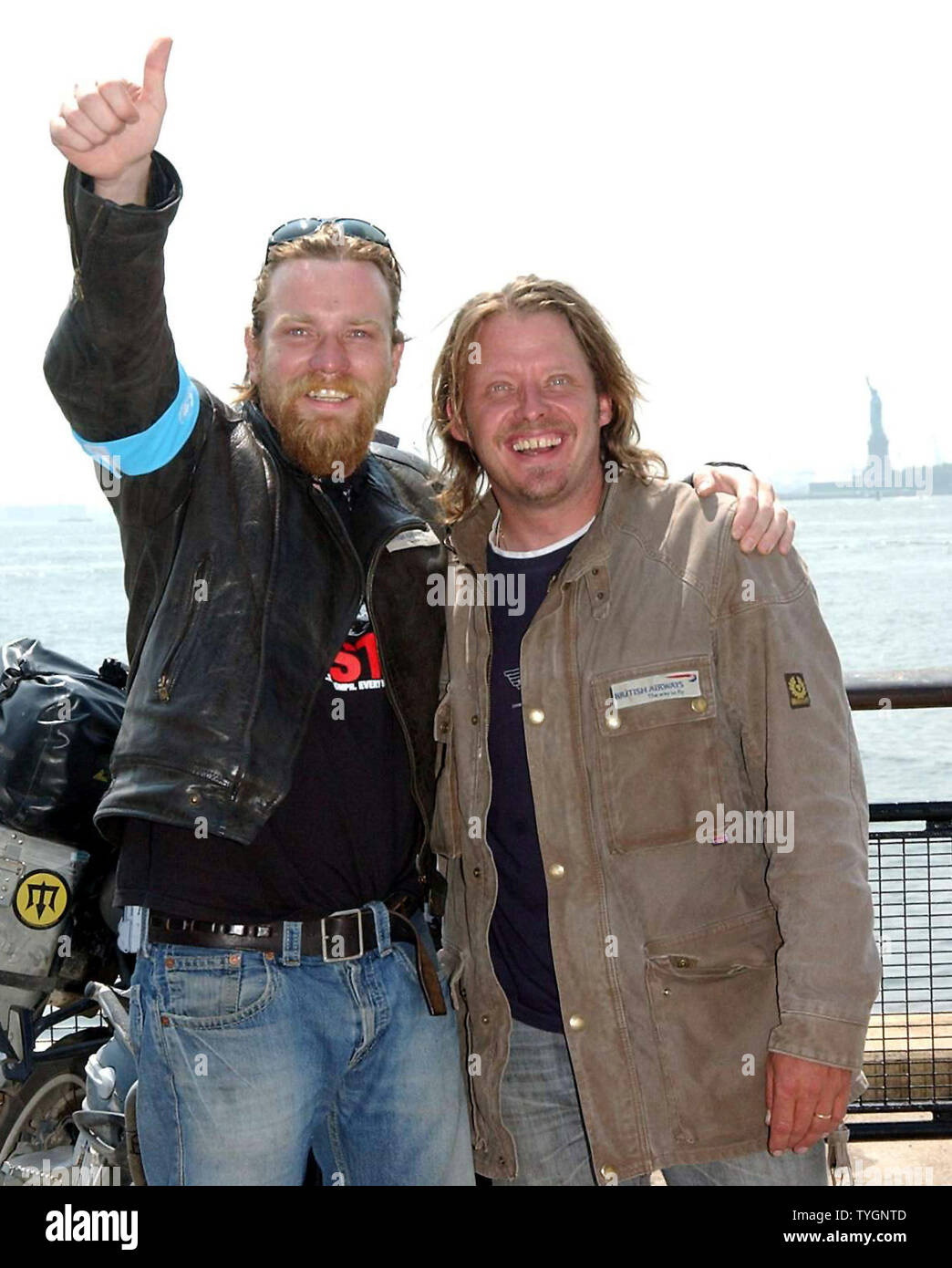 Actors Ewan McGregor and Charley Boorman right pose after they