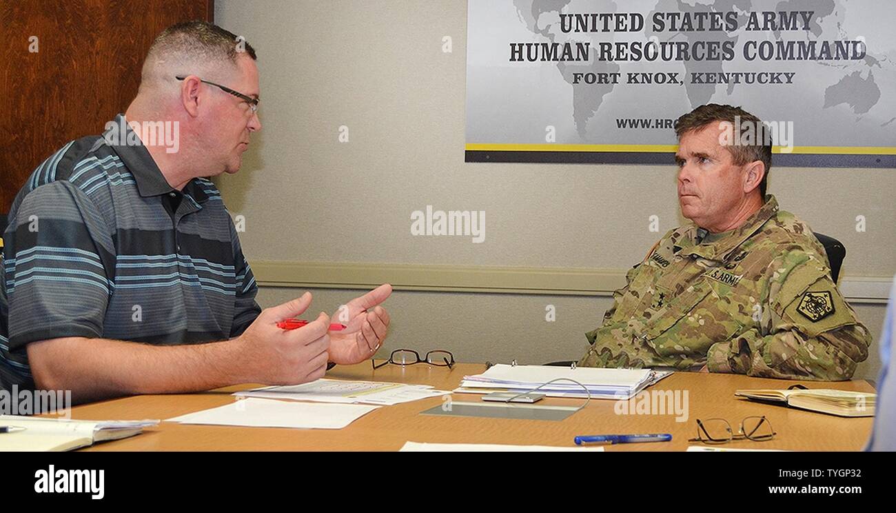 Arthur Dille, a human resources supervisor with U.S. Army Human Resources Command’s Enlisted Procedures and Soldier Actions Branch, briefs HRC Commander, Maj. Gen. Thomas C. Seamands, on upgrades to the online Assignment Satisfaction Key tool at HRC Headquarters, Fort Knox, Kentucky, Nov. 8, 2016. ASK allows enlisted active duty Soldiers up to the rank of E-8 non-promotable to take greater charge of their future assignments and career paths. Stock Photo