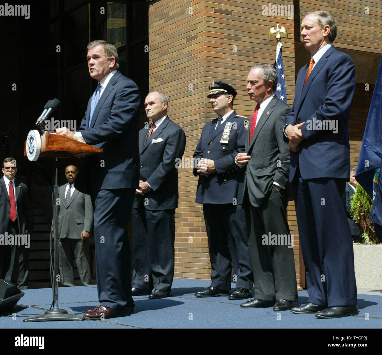 Secretary of Homeland Security Tom Ridge (L) discusses special security measures to be in place during the Republican National Convention as New York City Police commissioner Raymond Kelly (2nd L) Joseph Esposito, police chief of department, mayor Michael Bloomberg (2nd R) and New York State governor George Pataki listen during a press conferance at the NYPD headquarters August 25, 2004 in New York City.  (UPI Photo/Monika Graff) Stock Photo