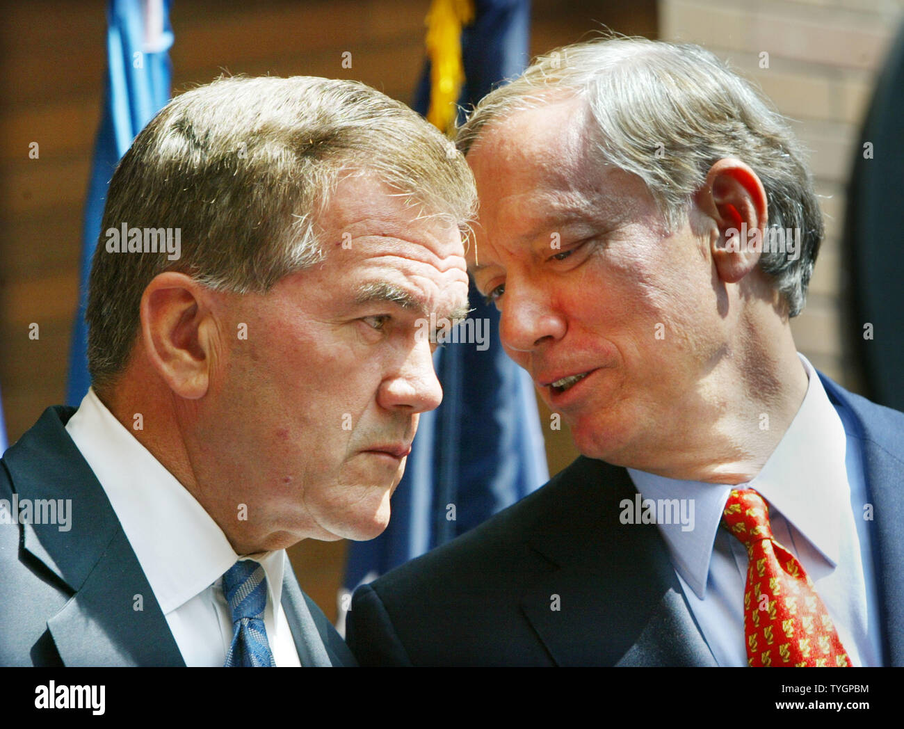 Secretary of Homeland Security Tom Ridge (L) listens to New York State governor George Pataki during a press conferance held to announce some of the special security measures that will be in place for the Republican National Convention and the demonstrators August 25, 2004 in New York City.  (UPI Photo/Monika Graff) Stock Photo