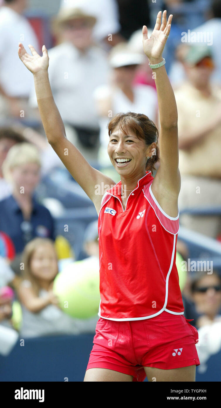 Shinobu Asagoe (JPN) raises her hands up after defeating Eleni Daniilidou (GRE) in 3 sets during day 8 action at the US Open in Flushing, New York on September 6, 2004.    (UPI Photo/John Angelillo) Stock Photo