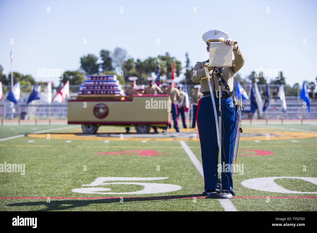 A U.S. Marine with Marine Corps Base, Camp Pendleton, reads Gen. John A