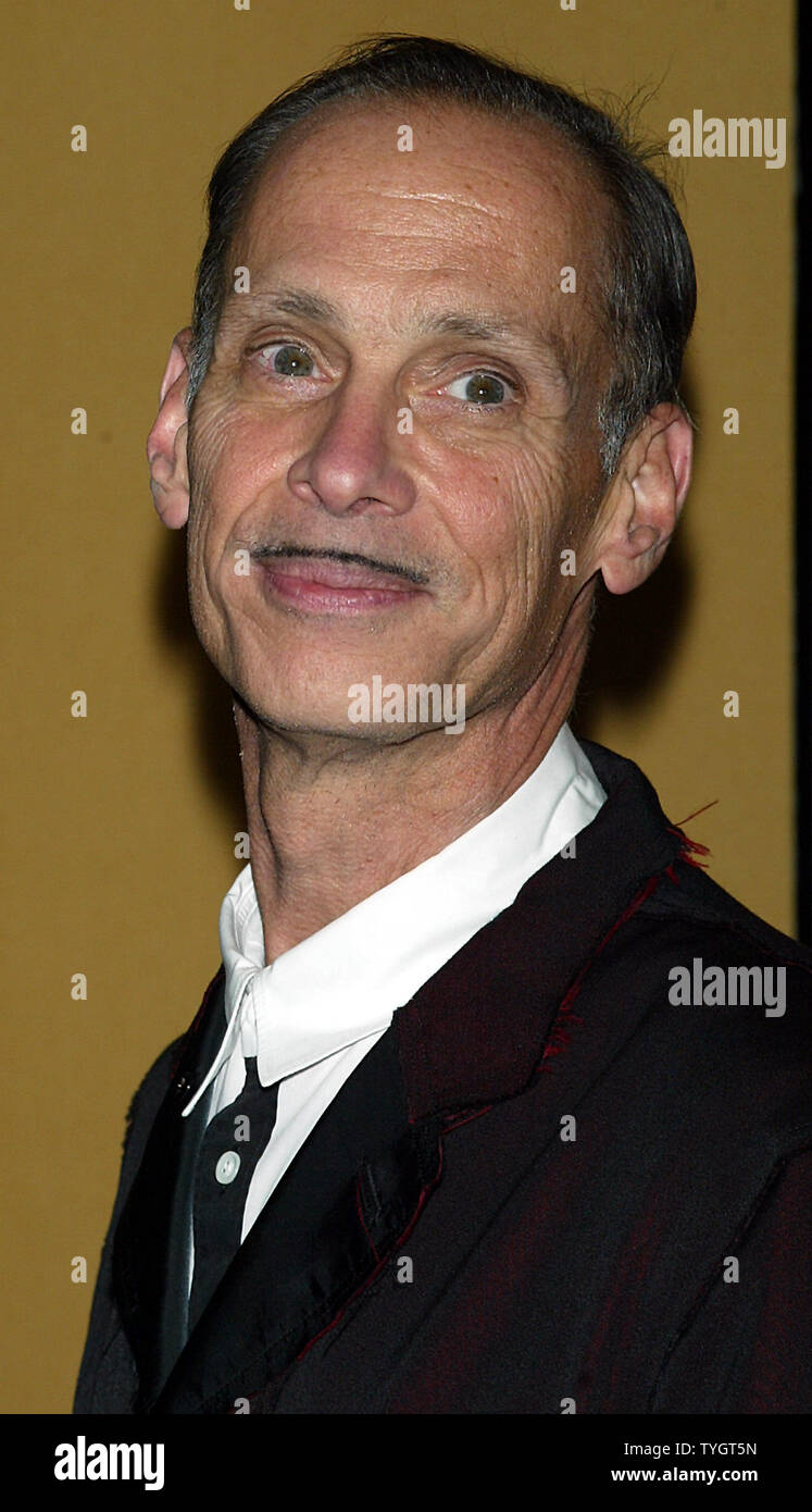 John Waters poses for pictures at the premiere of "A Dirty Shame" at the Union Square Theater in