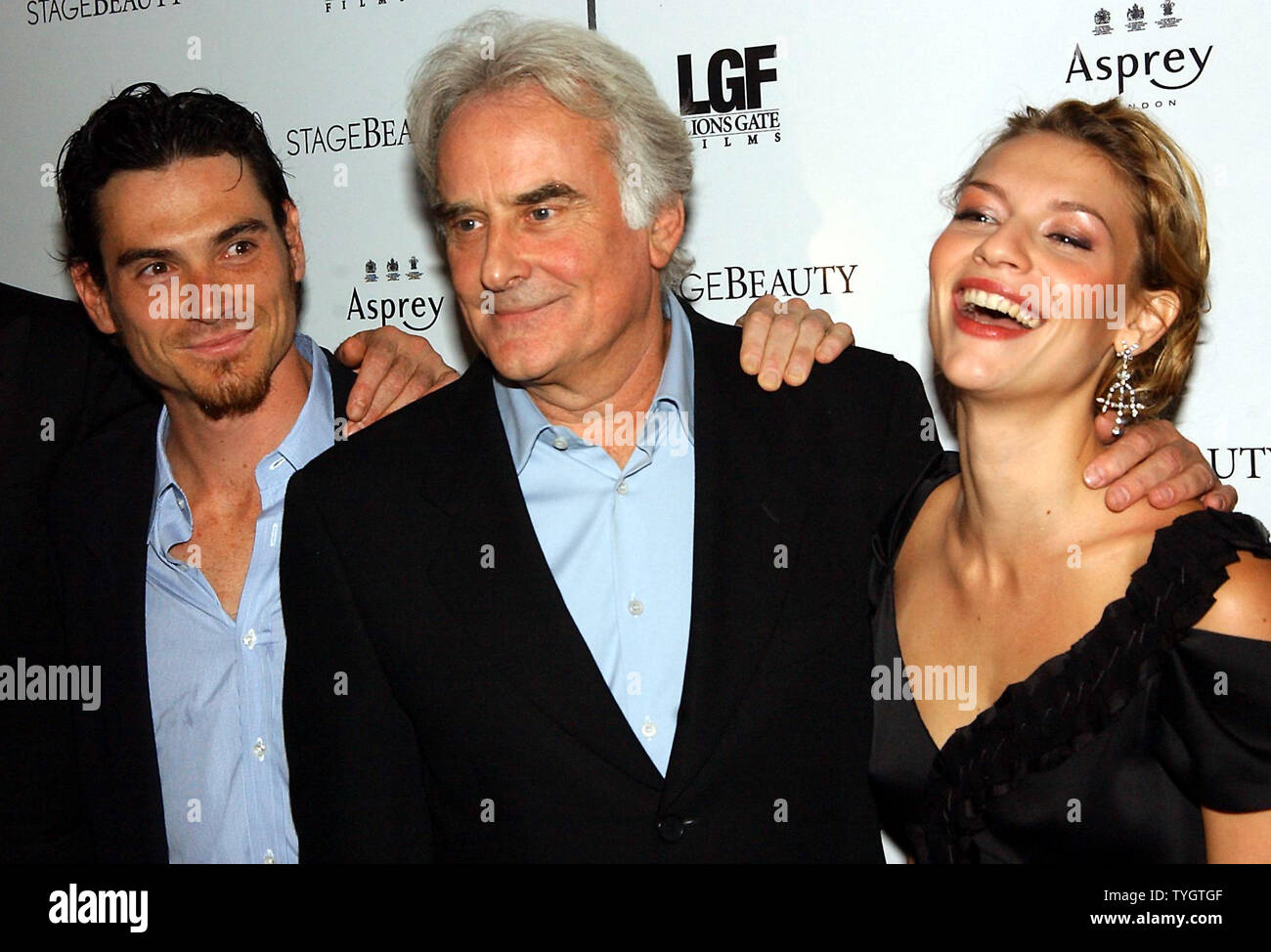 Actors  Billy Crudup and Claire Danes who became lovers on the set of their latest film 'Stage Beauty' succeed in not beign  photographed together during promotional stints  by placing the film's director Richard Eyre (center) between them at the Oct. 4, 2004 New York premiere of 'Stage Beauty'  (UPI Photo/Ezio Petersen) Stock Photo