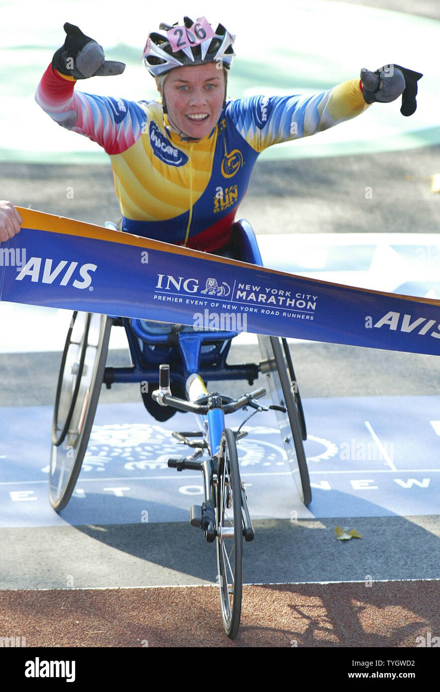 Edith Hunkeler (SUI) crosses the finish line as she wins the women's wheelchair division at the35th New York City Marathon November 7, 2004 in New York City. Over 30,000 runners participate in the city-wide race which is in it's 35th year. (UPI Photo/Monika Graff) Stock Photo