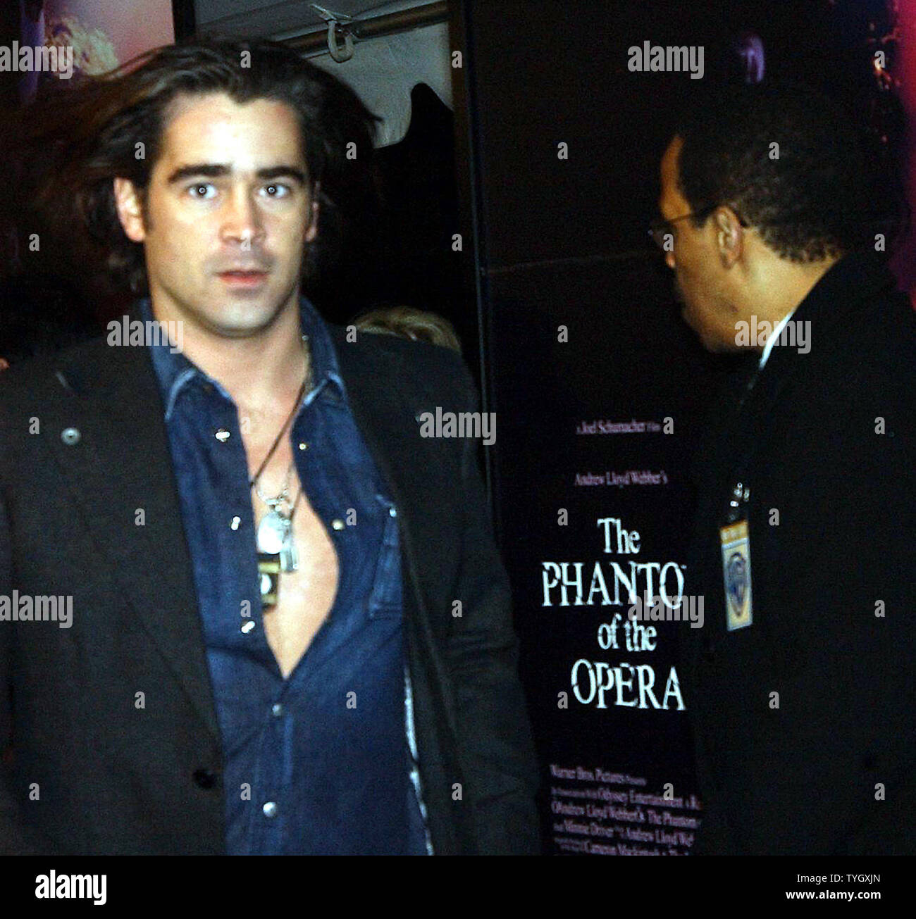 Actor Colin Farrell dashes past the media at the 12/12/04 New York premiere for the film 'The Phantom of the Opera' which is directed by his friend Joel Schumacher.  (UPI Photo/Ezio Petersen) Stock Photo