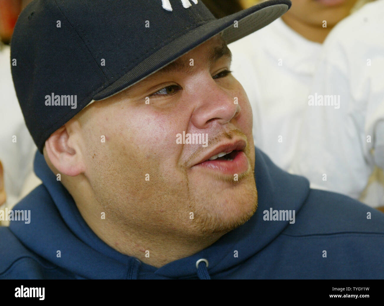 Joseph Cartegena, known as hip-hop artist Fat Joe, meets students at PS 146 where he has donated 20 new computers to the Bronx school, which he attended as a child, on December 21, 2004 in New York City.  (UPI Photo/Monika Graff) Stock Photo