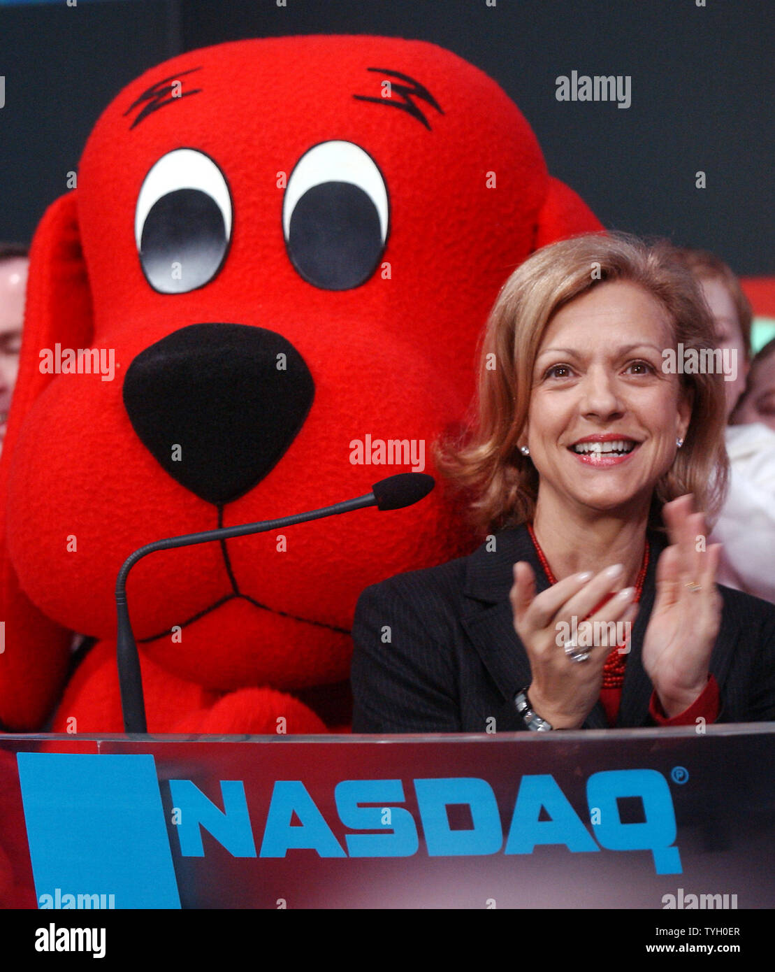 Deborah Forte, President of Scholastic Entertainment is joined by their  most famous book characther Clifford The Big Red Dog and Bob Greifeld, CEO  of NASDAQ at the 2/14/05 ceremonial NASDAQ opening bell