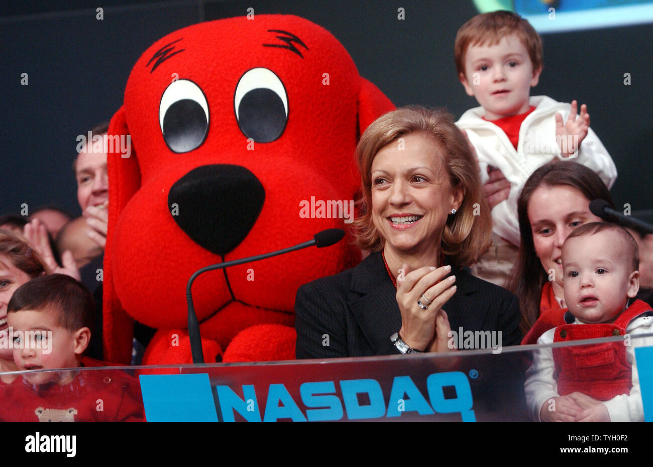 Deborah Forte, President of Scholastic Entertainment is joined by their  most famous book characther Clifford The Big Red Dog and Bob Greifeld, CEO  of NASDAQ at the 2/14/05 ceremonial NASDAQ opening bell