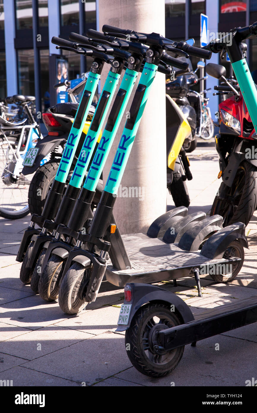 Tier electric scooters for rental at the main station, Cologne, Germany.  Tier Elektroscooter zum mieten am Hauptbahnhof, Koeln, Deutschland Stock  Photo - Alamy