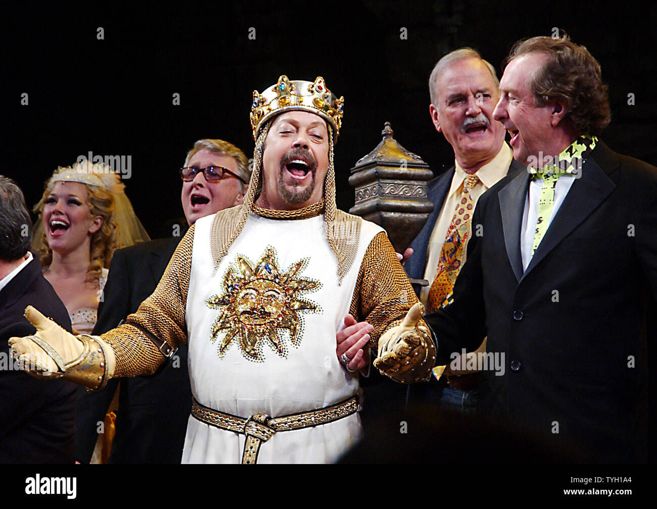 Director Mike Nichols, actor Tim Curry and Monty Python members John Cleese  and Eric Idle (shows composer/lyrcist) (left to right) take part in the  opening night curtain call bows on March 17,