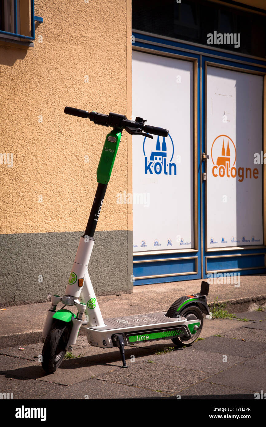 Lime-S electric scooter for rental in the city, Cologne, Germany.  Lime-S Elektroscooter zum mieten in der Innenstadt, Koeln, Deutschland. Stock Photo