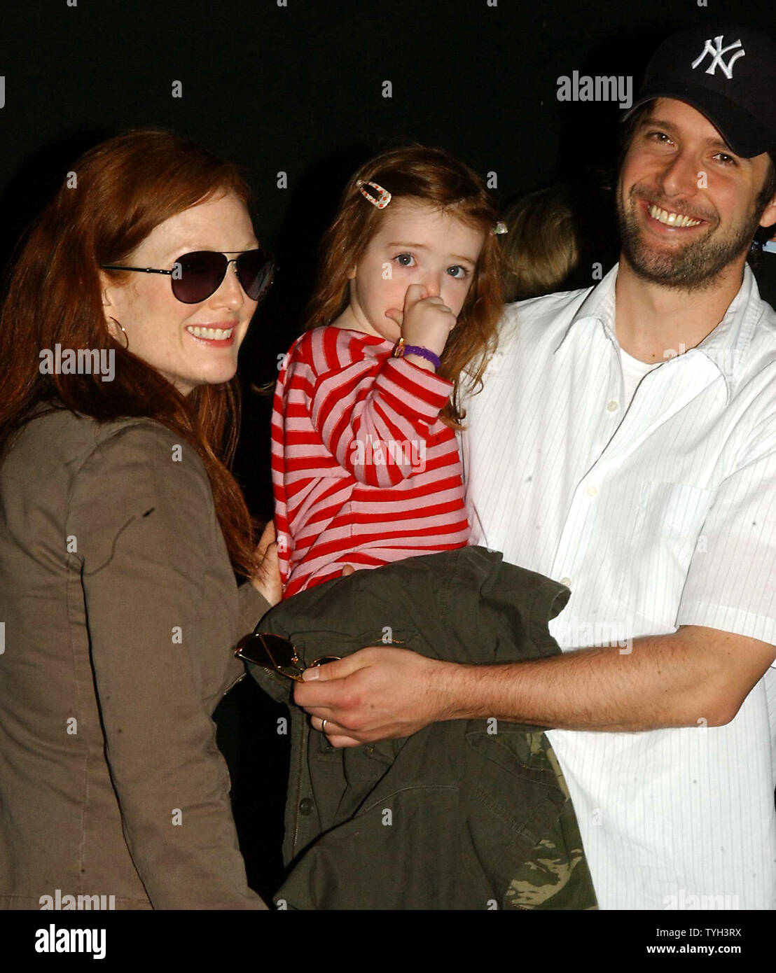 Actress Julianne Moore with daughter and husband Bart Freundlich attend the May 15, 2005 New York premiere of Dreamworks animated film 'Madagascar'.  (UPI Photo/Ezio Petersen) Stock Photo