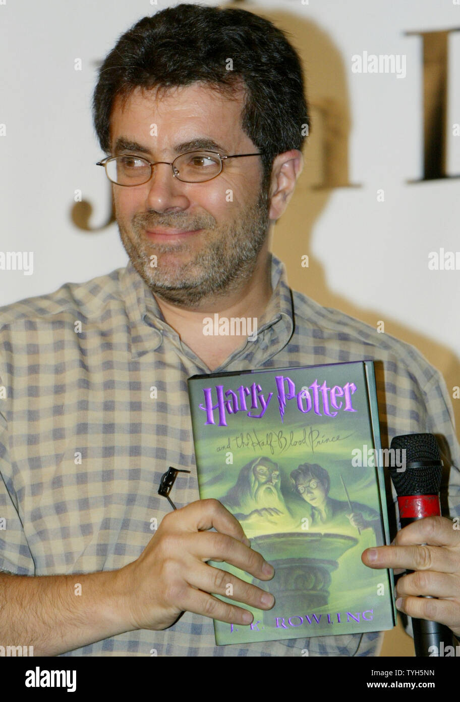 Steve Roggio, CEO of Barnes and Nobel, holds up a copy of  J.K Rowling's ' Harry Potter and the Half-Blood Prince' on July 15, 2005 in New York City. Riggio was on hand to introduce Jim Dale, the voice of the audio books, who read from the popular children's books.  (UPI Photo/Monika Graff) Stock Photo