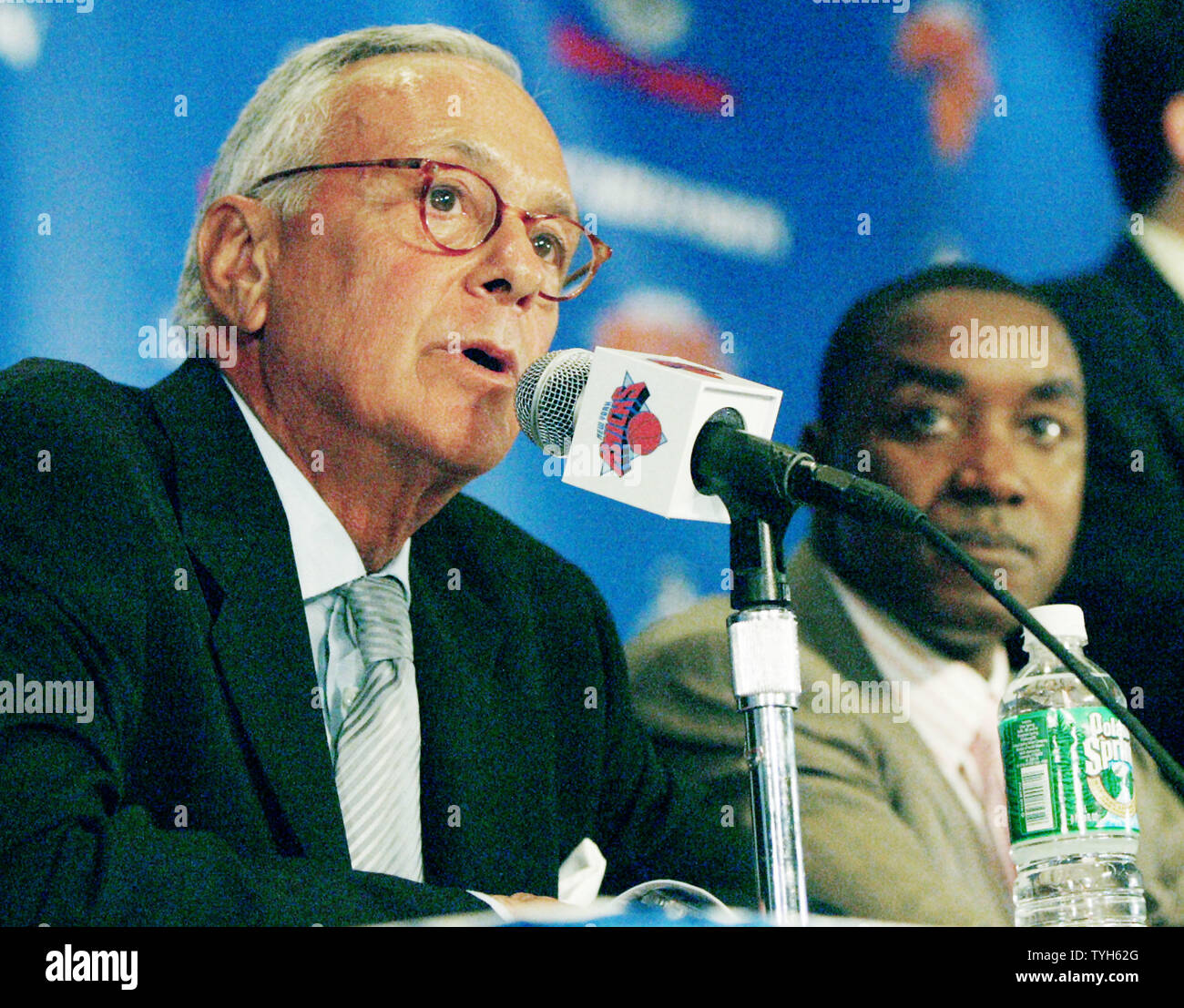 Larry Brown talks about his new position as head coach for the New York Knicks during a press conference at Madison Square Garden on July 28, 2005 in New York City. Brown, former coach for the Detroit Pistons, will be the highest paid basketball coach ever, receiving over $10 million a year.  Isiah Thomas, president of the team, listens. (UPI Photo/Monika Graff) Stock Photo