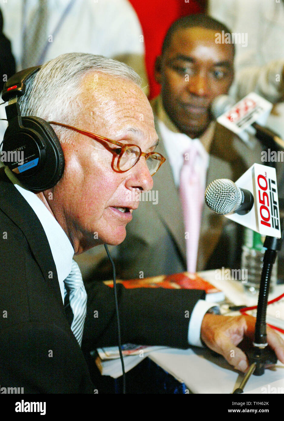 Basketball Hall of Famer Larry Brown, left, talks about his new possition as head coach for the New York Knicks' as the team's president Isiah Thomas listnes during a radio interview following a press conference at Madison Square Garden on July 28, 2005 in New York City. Brown, former coach for the Detroit Pistons, will be the highest paid basketball coach ever, receiving over $10 million a year.  (UPI Photo/Monika Graff) Stock Photo