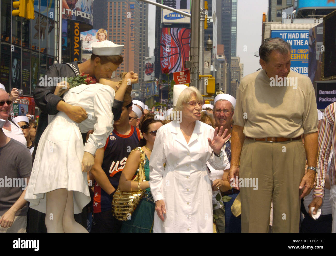 Edith Shain and Carl Muscarello are shown next to the Unconditional Surrender Sculpture at the 60th Anniversary of the end of World War II in Times Square on August 14, 2005.  They were recreating the famous pose from the Alfred Eisenstadt photograph celebrating the Allied victory in the war. They claim to be the original couple in the photograph.   (UPI Photo/Robin Platzer) Stock Photo