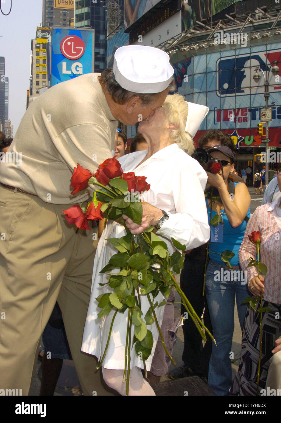 Edith Shain and Carl Muscarello are shown recreating a famous photo at the 60th Anniversary of the end of World War II in Times Square on August 14, 2005.  They were recreating the famous pose from the Alfred Eisenstadt photograph celebrating the Allied victory in the war. They claim to be the original couple in the photograph.   (UPI Photo/Robin Platzer) Stock Photo