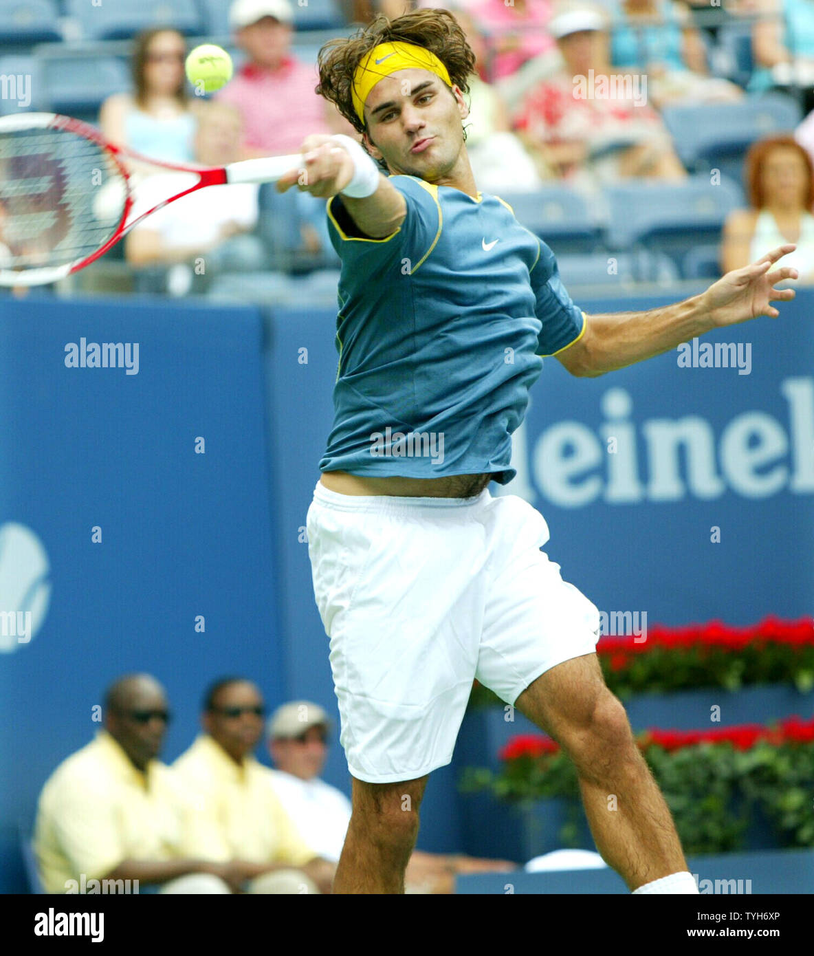 Roger Federer of Switzerland, winner of last year's US Open, returns the  ball to Ivo Minar of the Czech Republic and goes on to win 6-1, 6-1, 6-1  during the US Open