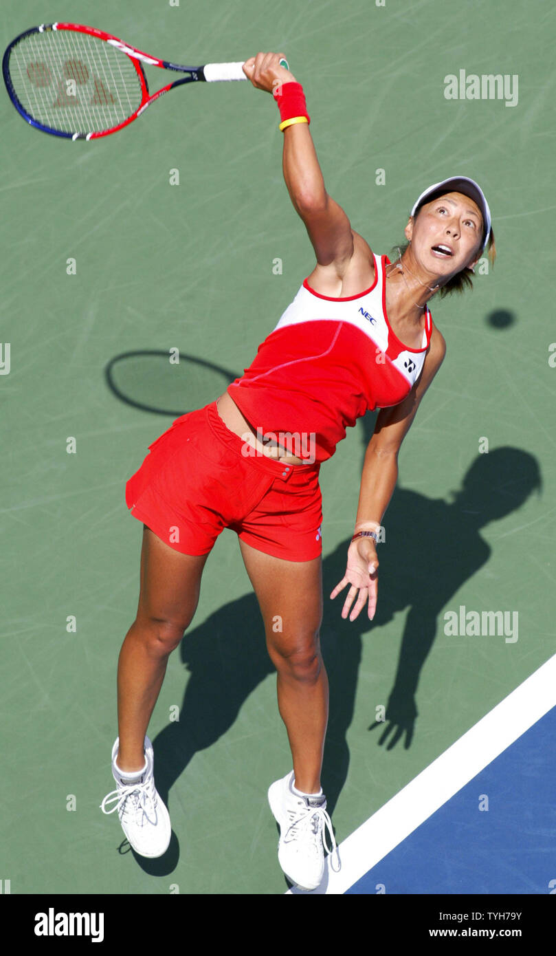 Shinobu Asagoe of Japan, who ranks 24th, serves to Patty Schnyder of