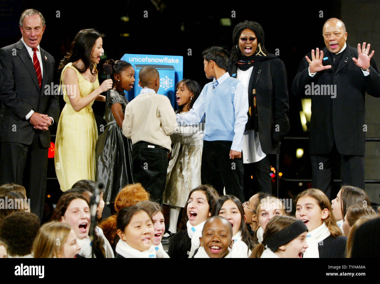 New York City mayor Michael Bloomberg, left, actor Lucy Liu, second left, comedien Whoppi Goldberg, second right, and music impresario Quincy Jones join children ,who are Hurricane Katrina and Asian tsunami survivors, on stage in a countdown for the lighing of the UNICEF crystal snowflake which hangs over Fifth Avenue on November 28, 2005 in New York City. This year's snowflake, which will be on display  through out the holiday season, is illuminated with 16,000 Baccarat crystal prisms and weighs more than 3,300 pounds. (UPI Photo/Monika Graff) Stock Photo